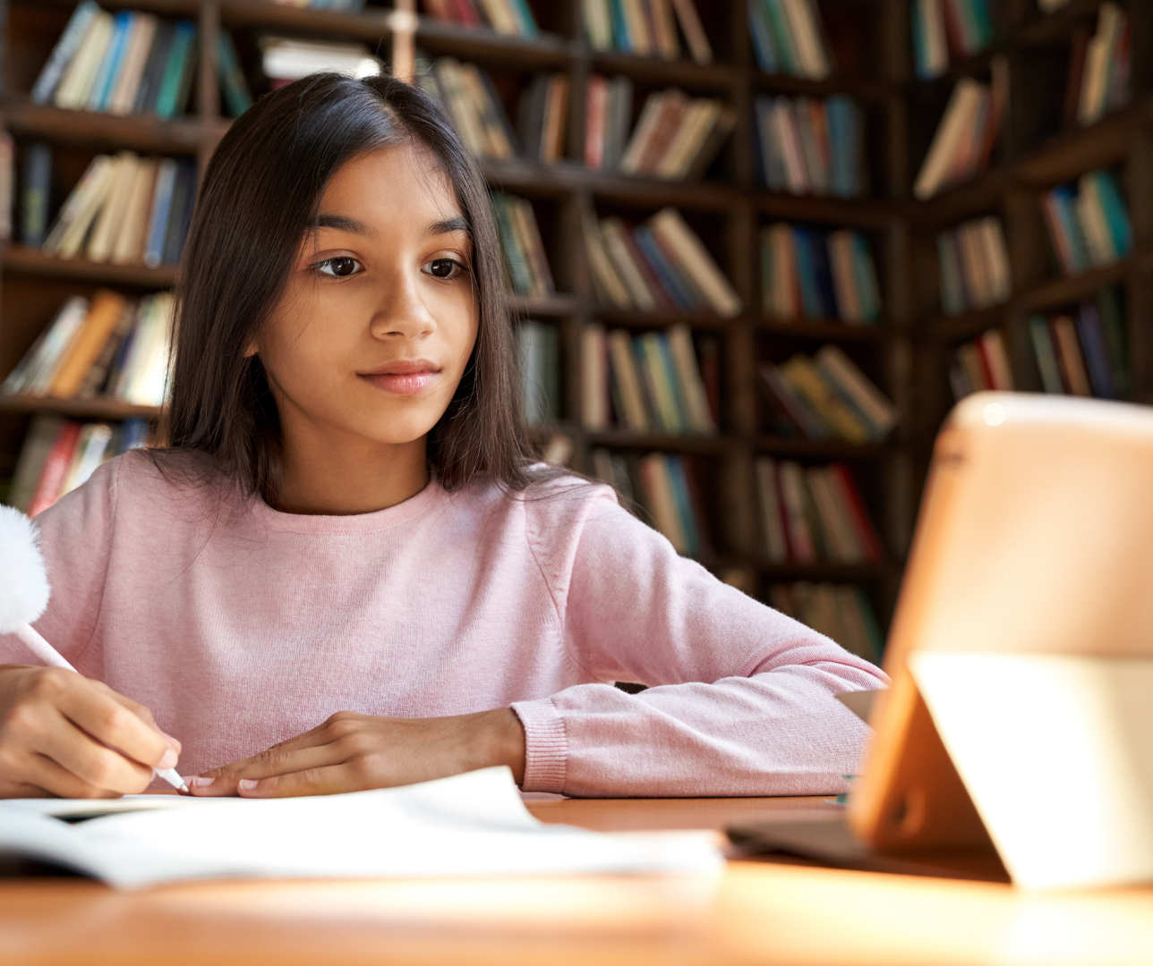 K-12 Students smiling and working in classroom 