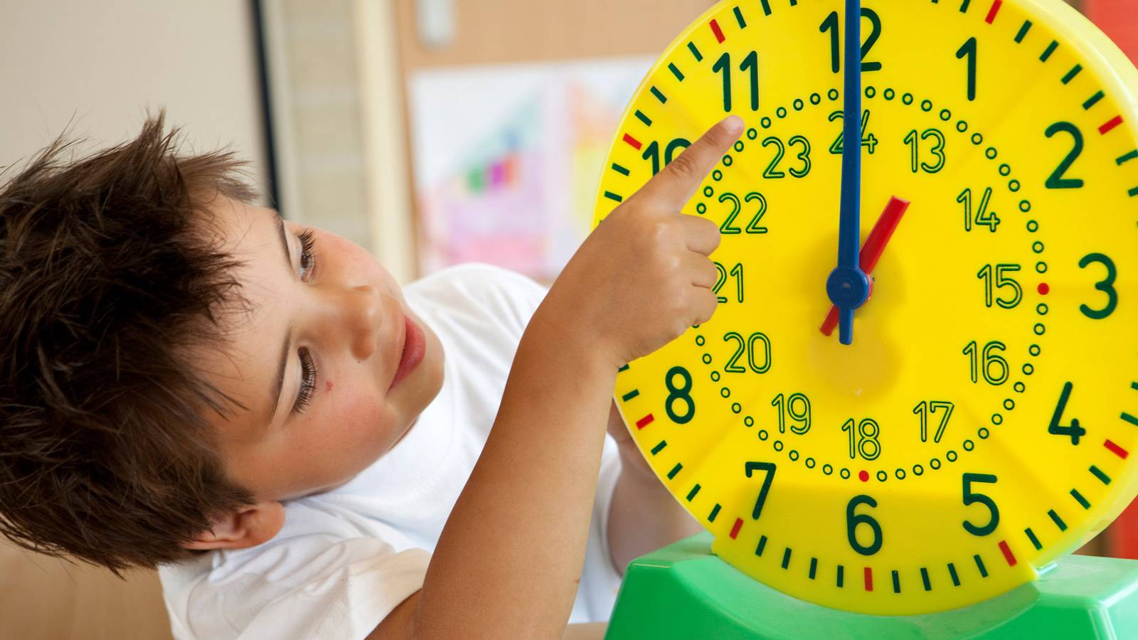 K-12 Students smiling and working in classroom 